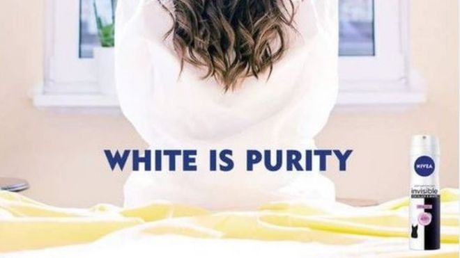 a screenshot of the advert: a woman is pictured back to camera in a white robe with the words 'white is purity' and an image of the can.