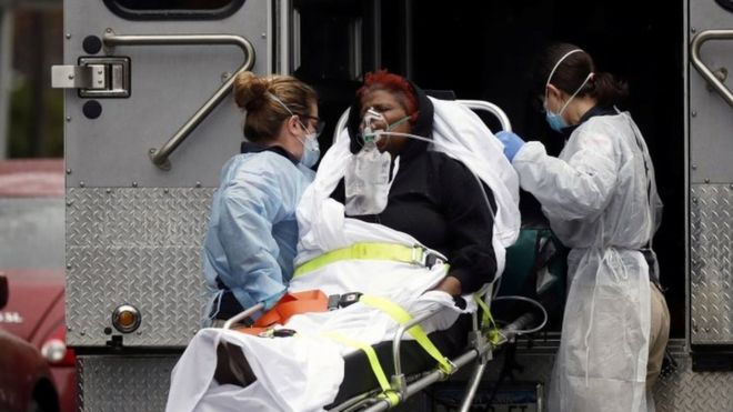 Medics bring a sick patient to an ambulance in New York City. Photo: 28 March 2020