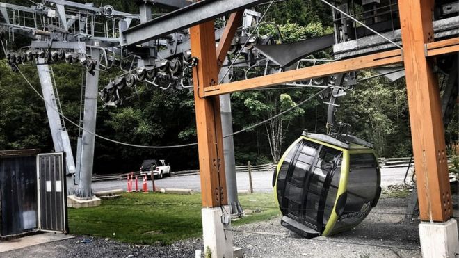 A cable car sits on the ground on a slack rope in this police handout