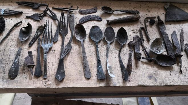 Objects found by renovators under a chimney in Block 17 at Auschwitz