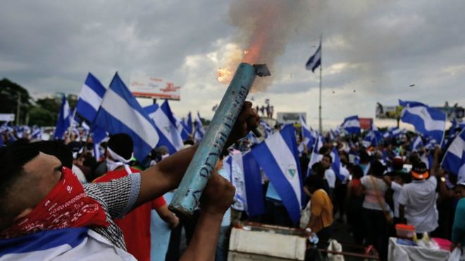 Anti-government demonstrator fires a home-made mortar during a protest in Managua on May 26, 2018