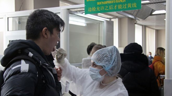 A Chinese citizen passing through a temporary corridor opened at a border checkpoint between Blagoveshchensk and Heihe.