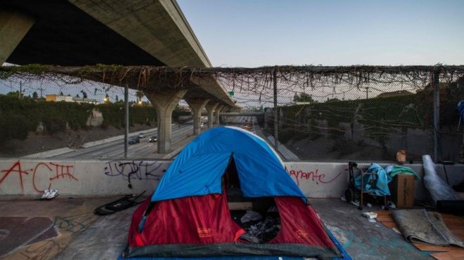A homeless tent is seen over a bridge in Los Angeles during the coronavirus outbreak