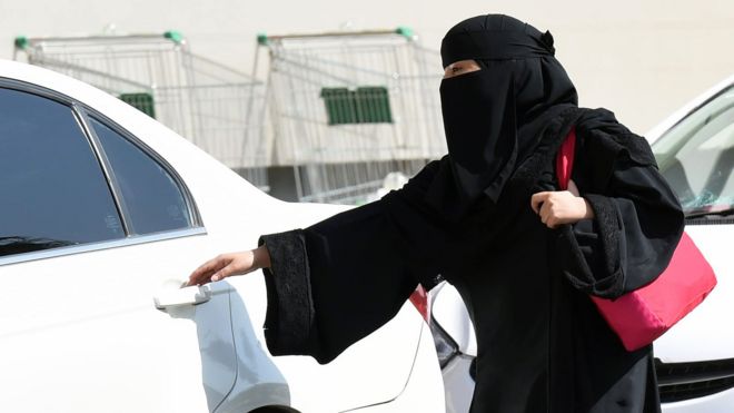 File image from October 2014 shows a Saudi woman getting into a taxi in Riyadh