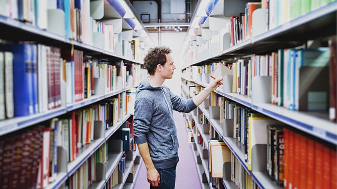 Student in university library