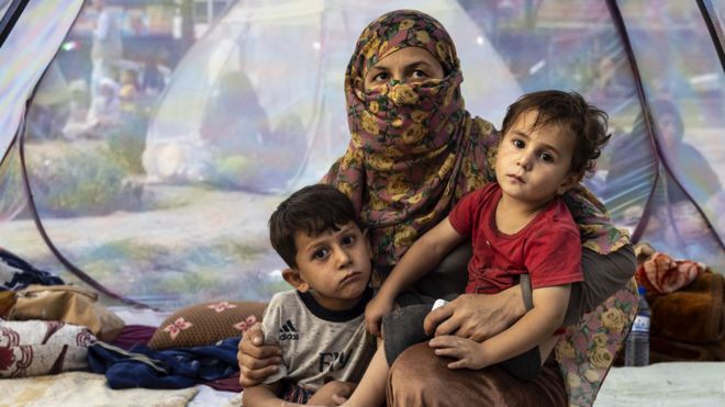 A displaced family in a tent at a makeshift camp in Kabul