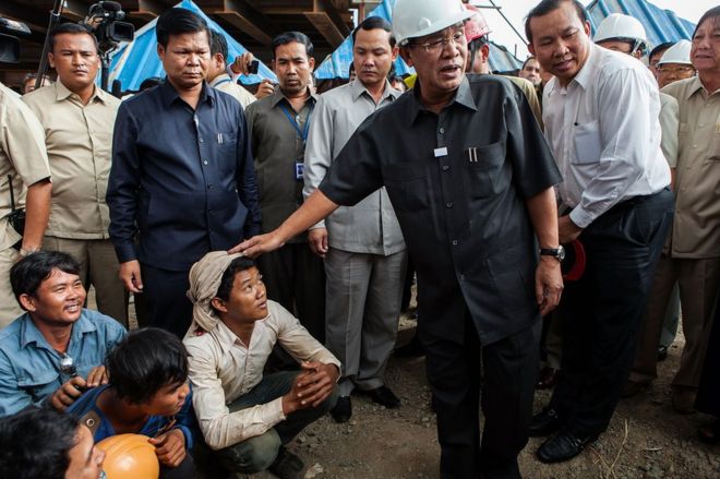 Cambodian Prime Minister Hun Sen makes his first public visit to the construction site of a bridge South of Phnom Penh on July 31, 2013 in Phnom Penh, Cambodia.