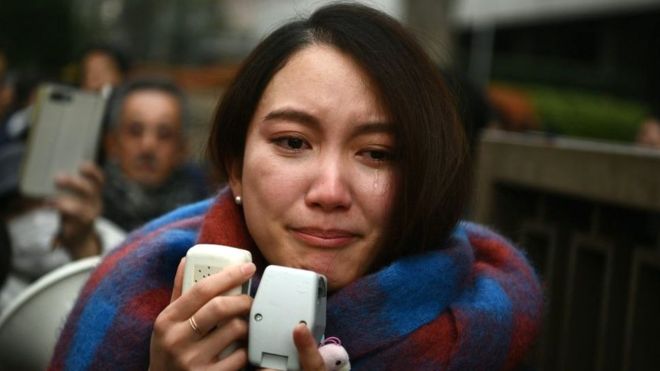 Japanese journalist Shiori Ito sheds a tear as she speaks to reporters outside the Tokyo district court on December 18, 2019 after hearing the ruling on a damages lawsuit by her, accusing a former TV reporter of rape