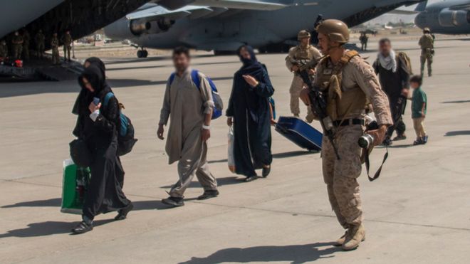UK Armed Forces leading evacuees at Kabul airport