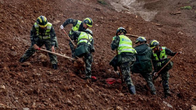 Rescuers search for survivors at the site of a landslide in Liupanshui in China"s southwestern Guizhou province