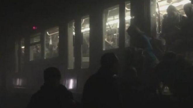 People evacuating a metro train