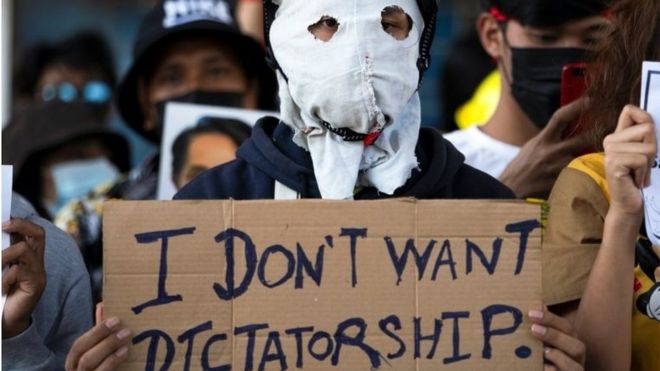 A demonstrator holds a placard during a rally against the military coup and to demand the release of elected leader Aung San Suu Kyi, in Yangon, Myanmar, February 10, 2021.