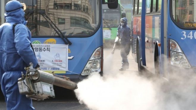 Workers spray disinfectant at a bus terminal in Seoul, South Korea. Photo: 20 February 2020