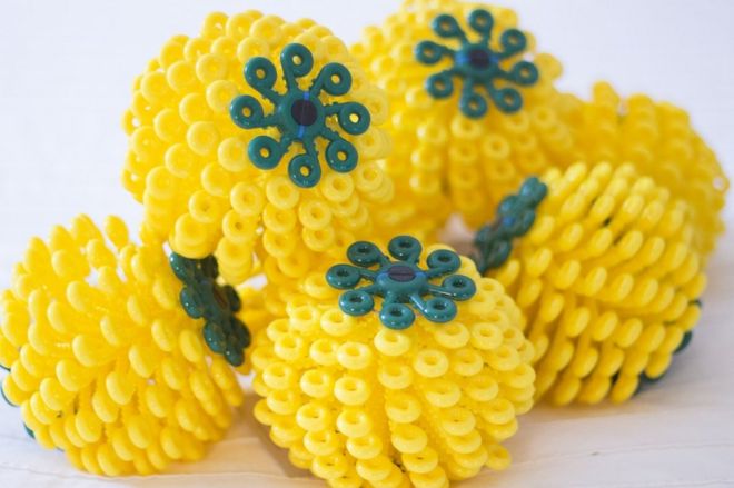 Yellow Cora Balls in a pile