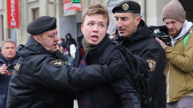 Police officers detain a journalist Roman Protasevich attempting to cover a rally in Minsk, Belarus, 26 March 2017