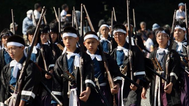Japanese boys taking place in historical re-enactment