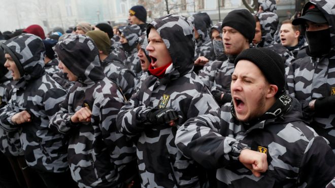 Activists of far-right parties shout slogans during a rally to support the Ukrainian navy