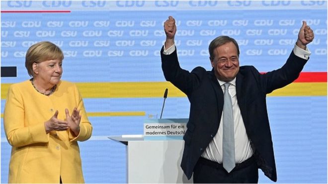German Chancellor Angela Merkel (L) and Armin Laschet (R), leader of Germany's conservative Christian Democratic Union (CDU) party