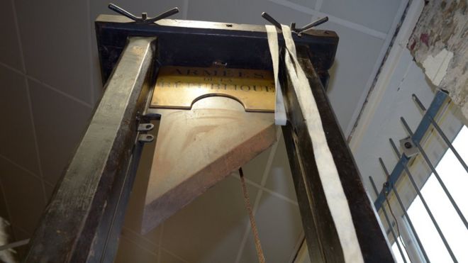 A guillotine is pictured in its auction room in Nantes, western France, on March 25, 2014.