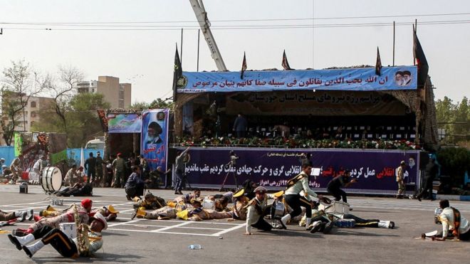 Injured soldiers lying on the ground after an attack on the military parade in Ahvaz