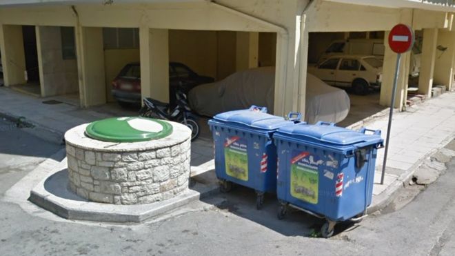 Google street view shows two bins and a large stone rubbish chute