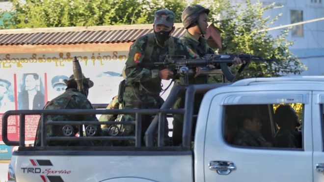In this photograph taken on November 22, 2016, armed Myanmar government militia, belonging to the Border Guard Force, patrol Muse town located in Shan State that borders China"s Yunnan province as clashes between the military and ethnic insurgents increased.