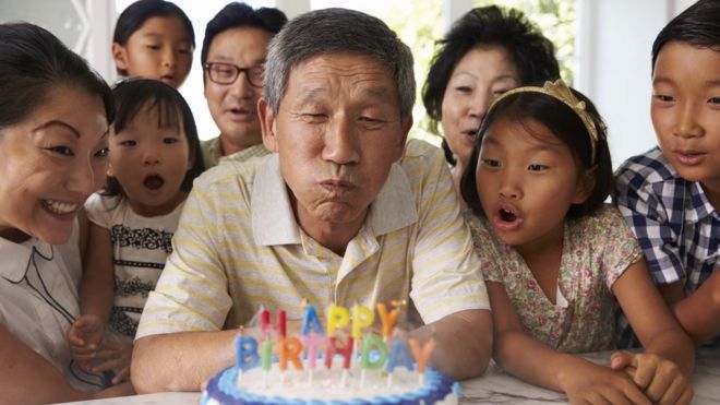 Blowing out birthday cake