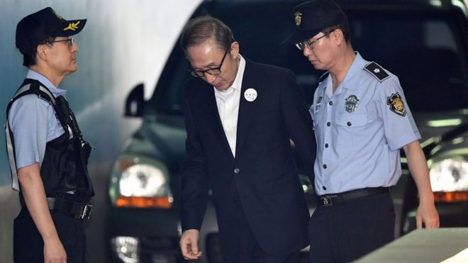 Former president Lee Myung-bak arriving at court in Seoul in September