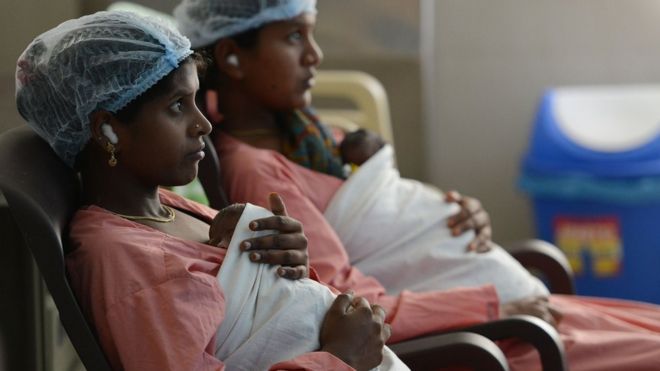 women with newborn babies in a maternity ward