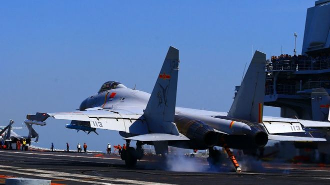 A Chinese J15 fighter jet landing on an aircraft carrier, 24 April 2018