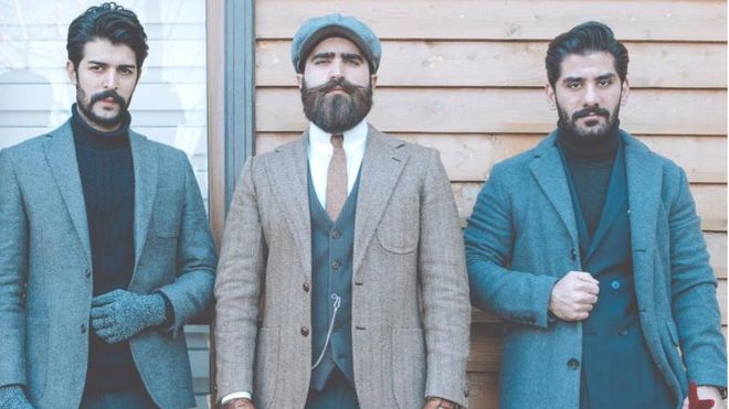 Iraqi men posing in suits