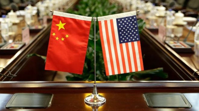 Flags of the US and China are placed ahead of a meeting