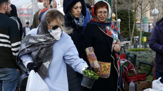 Iranian women shop for Nowruz items at a market in Tehran (19 March 2020)