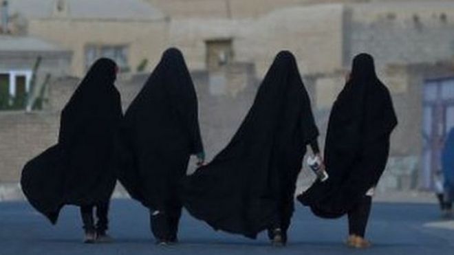 Women walking on a road