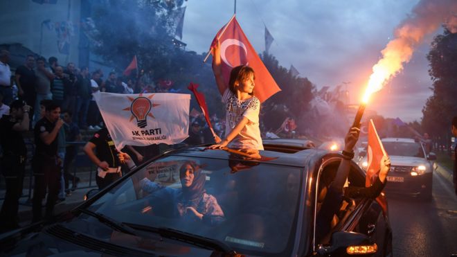 Supporters celebrate outside the AK party headquarters on June 24, 2018 in Istanbul, Turkey