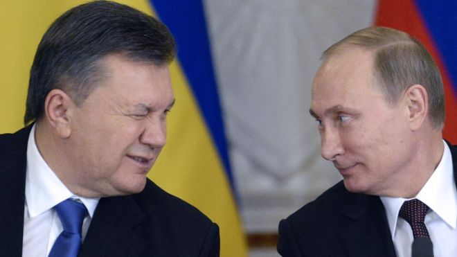 Экс-президент Украины Виктор Янукович (слева) и Владимир Путин
