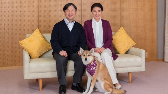 Japan's Crown Prince Naruhito and Crown Princess Masako pose for a photograph with their pet dog Yuri, 4 December 2018