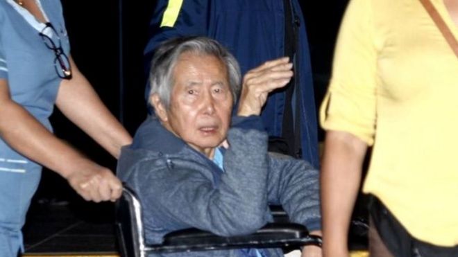 Former Peruvian President Alberto Fujimori accompanied by his son Kenji Fujimori leaves Centenario hospital in Lima, 4 January 2018