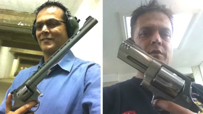 Dr Mohinder Surdhar posing with guns