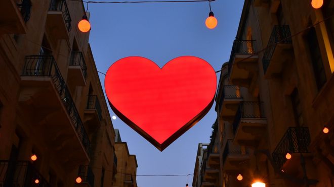 Illuminated signs of Valentine's Day decorate a shopping district in Beirut, Lebanon, 8 February 2017