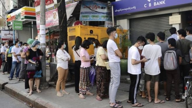 People line up outside a bank branch in Yangon, Myanmar, 1 February 2021.