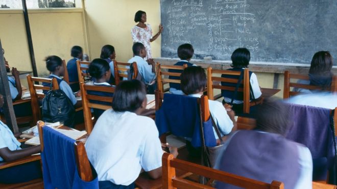 Pupils in a school classroom, learning French, in Ghana