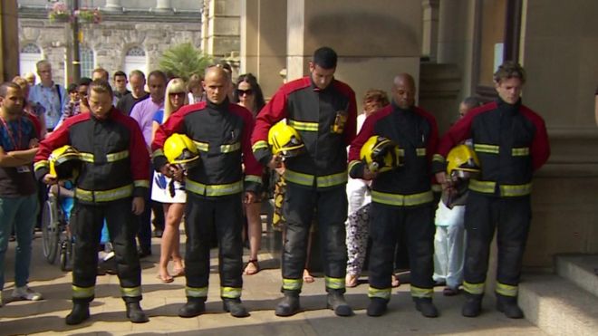 Firefighters observing the minute's silence
