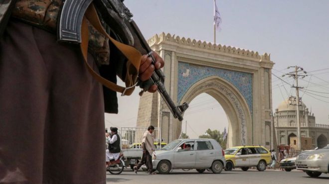 Taliban fighter stands guard at a checkpoint in Kandahar, Afghanistan, 17 August 2021.