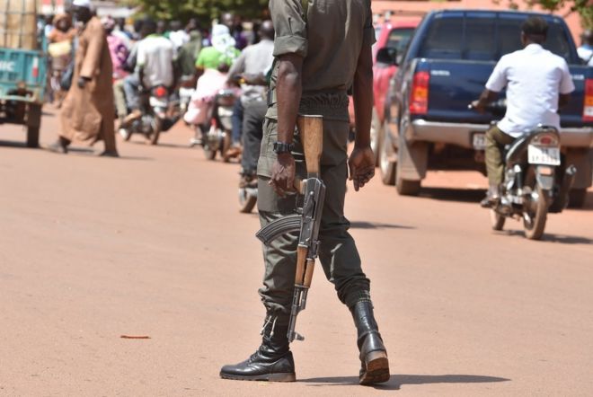 A picture taken on 29 October 2018 shows a policeman patrolling in the centre of Ouahigouya, eastern Burkina Faso.