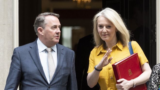 Liam Fox and Liz Truss, the former trade secretary and his successor