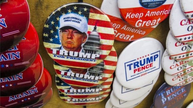 Campaign buttons are displayed for sale before US President Donald J. Trump"s campaign rally
