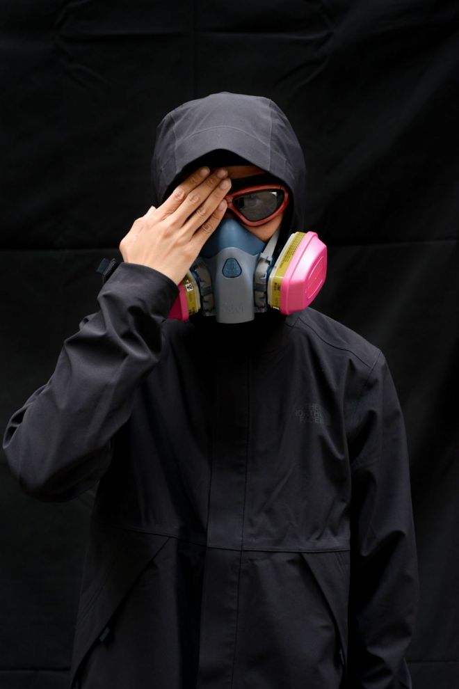 A protester poses for a portrait during the Anti-Totalitarianism march in Causeway Bay, Hong Kong, 29 September 2019