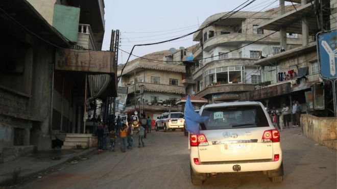 A convoy heads to deliver food and humanitarian supplies to the Syrian besieged town of Madaya, near Damascus on 25 September