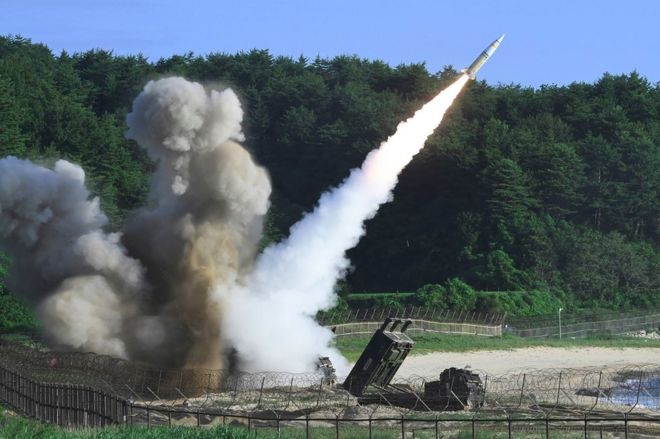 This handout photo taken on 5 July 2017 and provided by South Korean Defence Ministry in Seoul shows US M270 Multiple Launch Rocket System firing an MGM-140 Army Tactical Missile from an undisclosed location on South Korea's east coast during a South Korea-US joint missile drill aimed to counter North Koreas ICBM test.